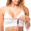Why choose the placement of breast implants plus a lift during your chest surgery Woman Measuring Her Chest Size Over White Background