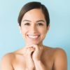 Am I a candidate for a mid-facelift? Happy Charming Female Isolated On Plain Background