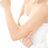 Are you a candidate for an arm lift? Woman checking her upper arm